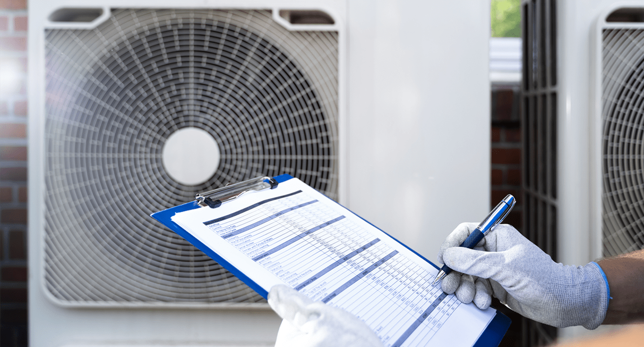 An Electrician Men Checking Air Conditioning Unit stock photo